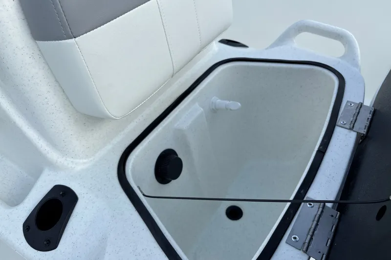 Slide: The Image of 2026 Mako Pro Skiff 15 CC boat seat with integrated storage compartment. - 13