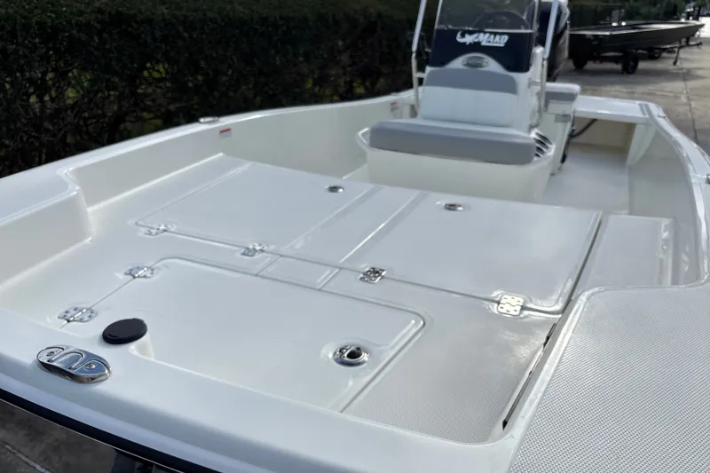 Slide: The Image of 2026 Mako Pro Skiff 15 CC boat interior with sleek white deck and console. - 7