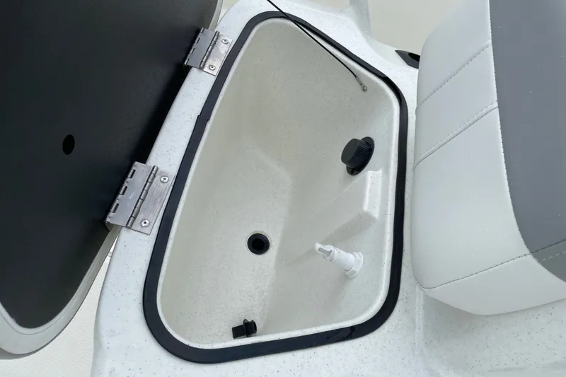 Slide: The Image of Open storage compartment in 2026 Mako Pro Skiff 15 CC boat. - 14