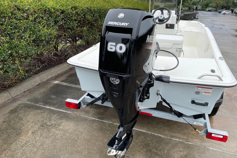 Slide: The Image of 2026 Mako Pro Skiff 15 CC with Mercury 60 outboard motor on trailer. - 6