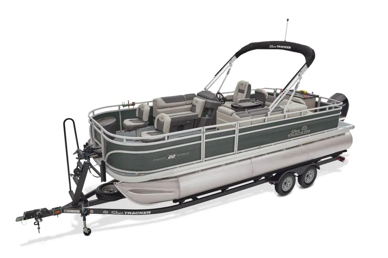 Slide: The Image of 2026 Sun Tracker Fishin' Barge 22 XP3 pontoon boat with outboard motor in snowy setting. - 6