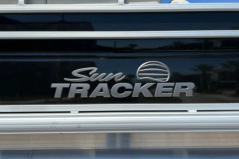 Slide: The Image of 2026 Sun Tracker Fishin' Barge 22 DLX logo on boat exterior. - 34
