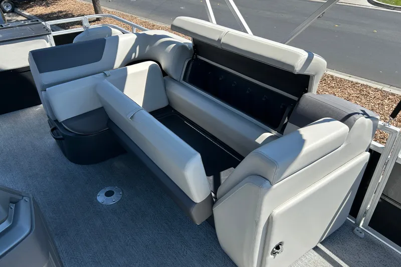 Slide: The Image of 2026 Sun Tracker Fishin' Barge 22 DLX interior seating with gray upholstery. - 16