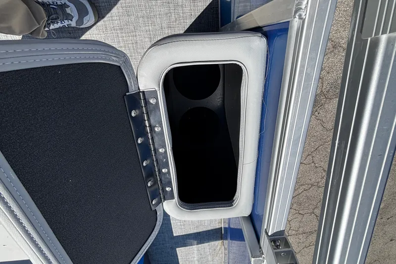 Slide: The Image of Open storage compartment on 2026 Sun Tracker Party Barge 22 RF DLX pontoon boat. - 12