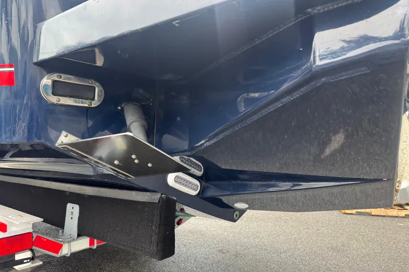 Slide: The Image of 2018 Regulator 34SS boat stern detail with trim tab and trailer. - 104