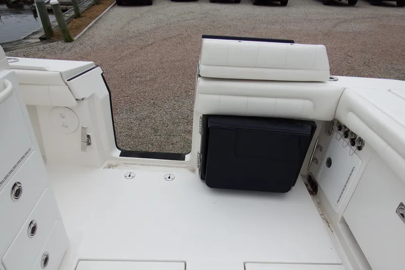 Slide: The Image of 2018 Regulator 34SS boat interior with seating and storage compartments. - 11