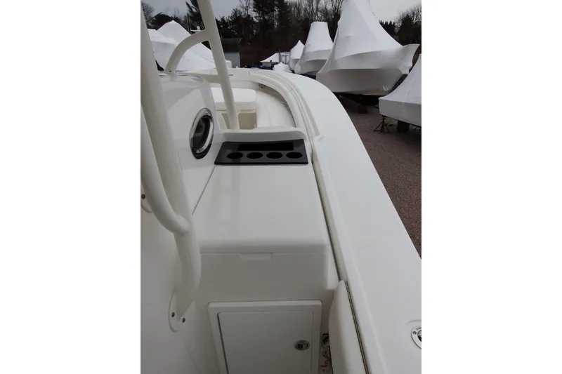 Slide: The Image of 2018 Regulator 34SS boat deck with rod holders, docked and covered. - 14