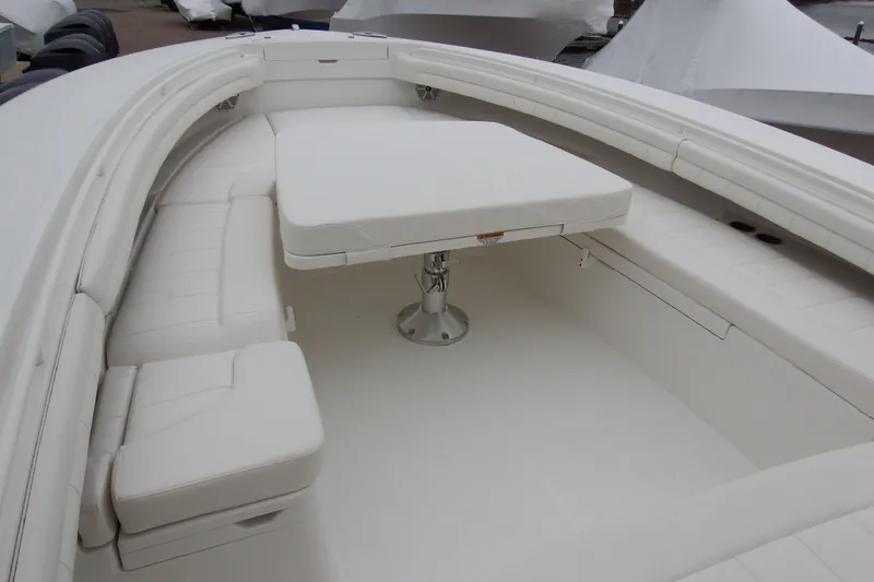 Slide: The Image of 2018 Regulator 34SS boat interior with white seating and table. - 15
