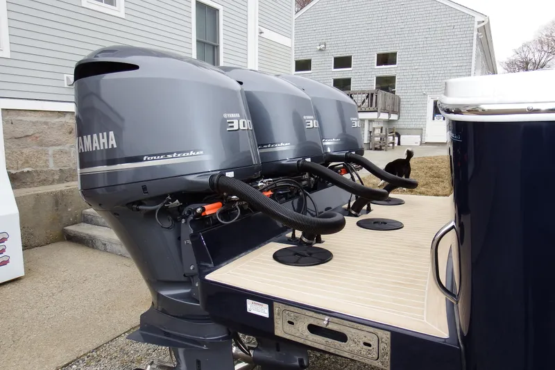 Slide: The Image of 2018 Regulator 34SS boat with triple Yamaha 300 outboard engines. - 2