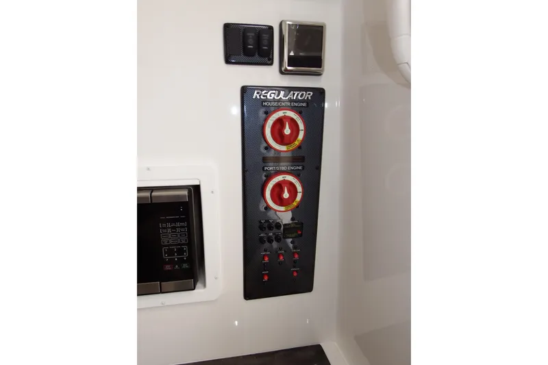 Slide: The Image of Control panel of 2018 Regulator 34SS boat with switches and dials. - 20