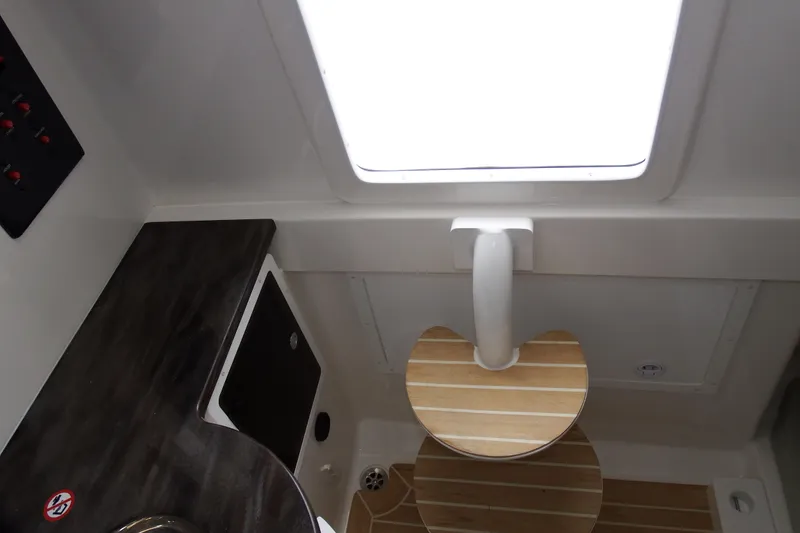 Slide: The Image of 2018 Regulator 34SS cabin interior with wooden flooring and countertop. - 29