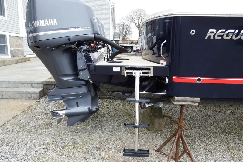Slide: The Image of 2018 Regulator 34SS boat with Yamaha outboard motor and swim ladder. - 3