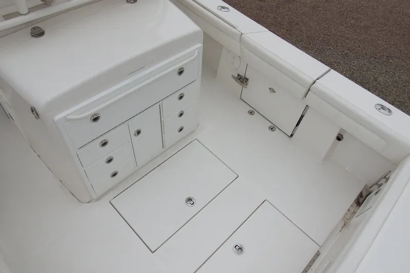 Slide: The Image of 2018 Regulator 34SS boat interior with storage compartments and seating. - 32