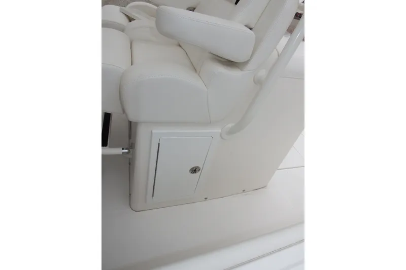 Slide: The Image of 2018 Regulator 34SS boat seat with storage compartment, white upholstery. - 33