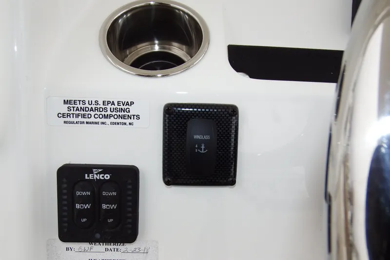 Slide: The Image of Control panel of a 2018 Regulator 34SS boat with Lenco and windlass switches. - 34