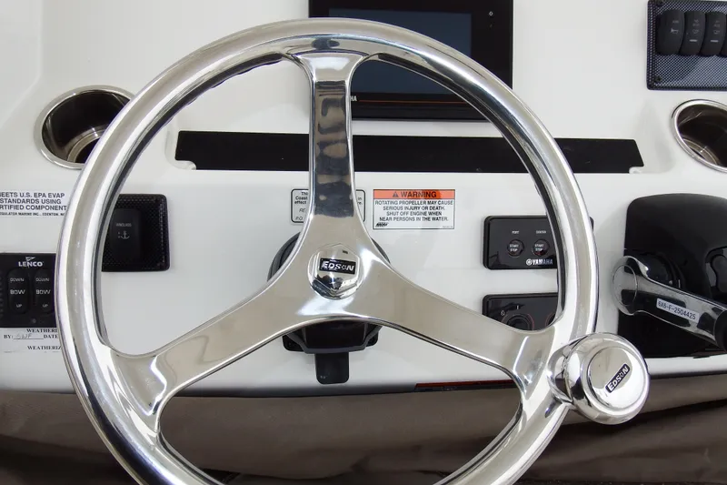 Slide: The Image of Steering wheel of 2018 Regulator 34SS boat with control panel and throttle. - 35