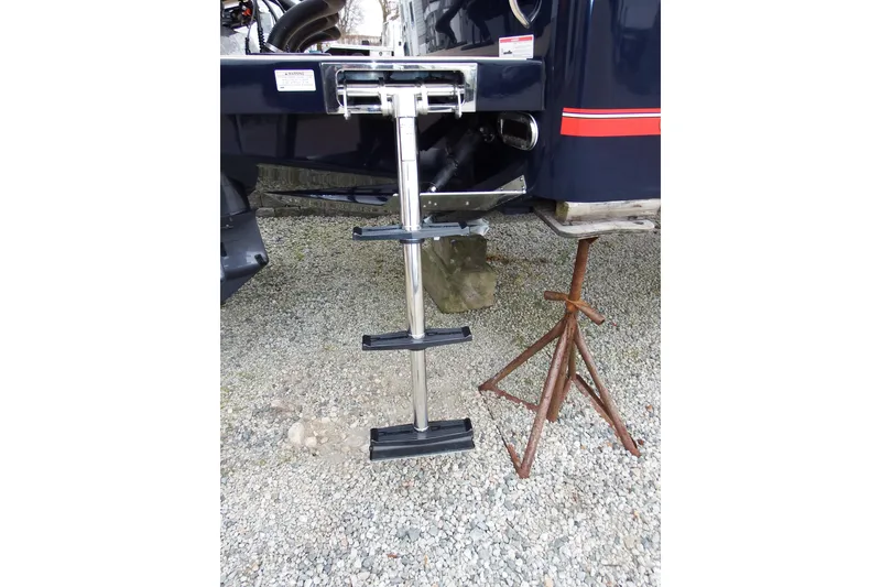 Slide: The Image of 2018 Regulator 34SS boat ladder on gravel with support stand. - 4