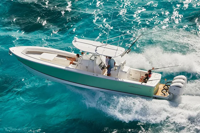 Slide: The Image of Interior of a 2018 Regulator 34SS boat featuring a microwave and control panel. - 43