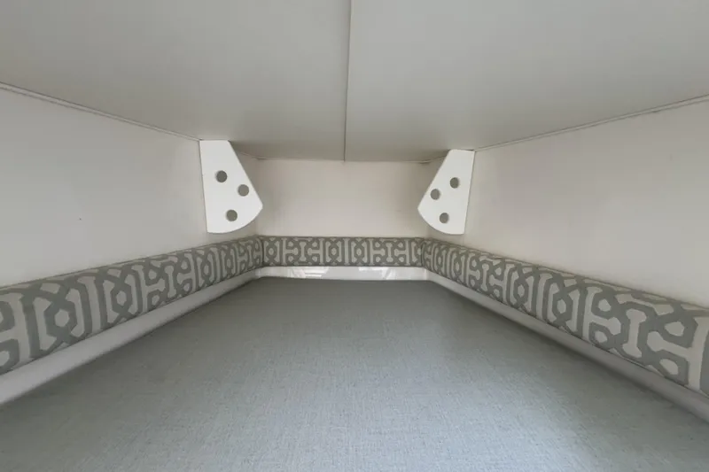 Slide: The Image of Interior cabin of 2018 Regulator 34SS boat with patterned cushions. - 57