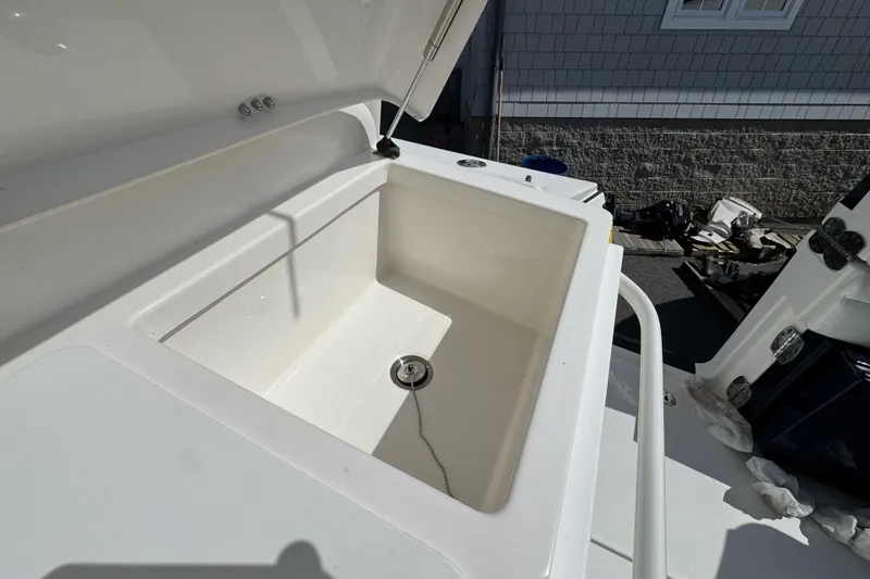 Slide: The Image of Open storage compartment on 2018 Regulator 34SS boat, showcasing interior space. - 67