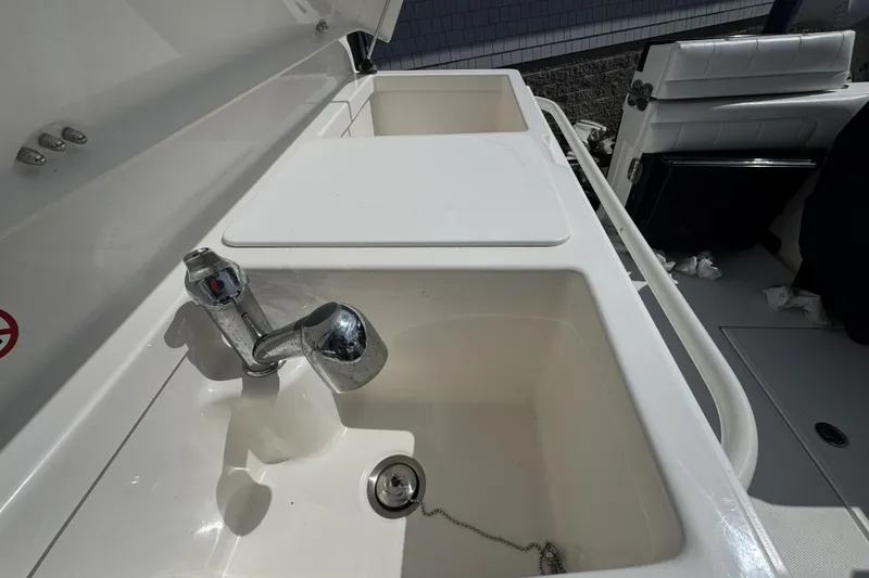 Slide: The Image of 2018 Regulator 34SS boat sink and faucet detail, showcasing sleek design and functionality. - 69