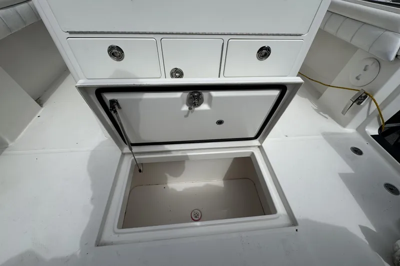 Slide: The Image of Open storage compartment on 2018 Regulator 34SS boat deck. - 75