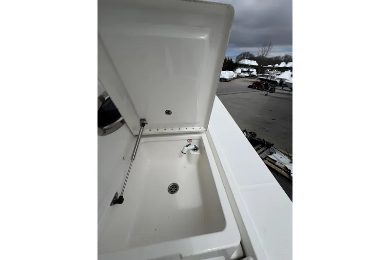 Slide: The Image of Open storage compartment on 2018 Regulator 34SS boat, showcasing interior details. - 76