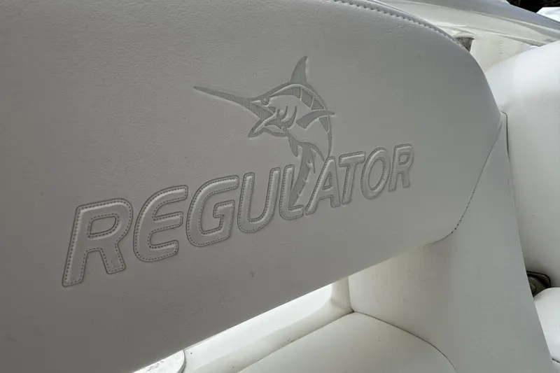 Slide: The Image of 2018 Regulator 34SS boat seat with embossed logo and marlin design. - 79