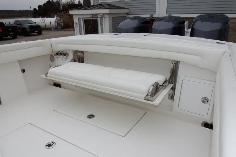 Slide: The Image of 2018 Regulator 34SS boat interior with foldable seating and storage compartments. - 8
