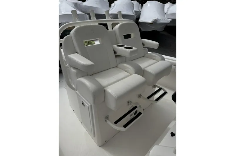 Slide: The Image of 2018 Regulator 34SS boat seats with armrests and cup holders. - 80