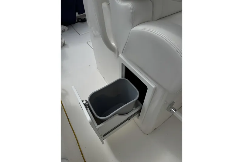 Slide: The Image of Pull-out trash bin in 2018 Regulator 34SS boat interior. - 81