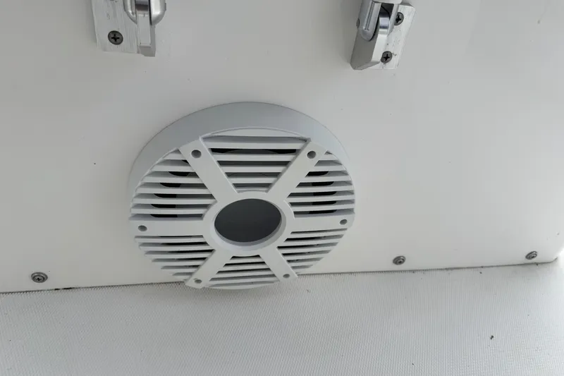 Slide: The Image of Speaker grille on a 2018 Regulator 34SS boat, mounted on a white surface. - 85