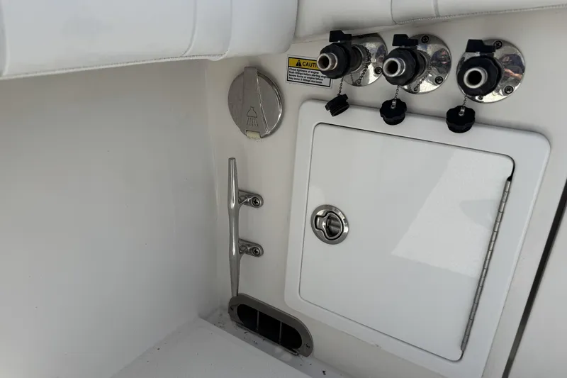Slide: The Image of 2018 Regulator 34SS boat interior with control panel and storage compartment. - 89