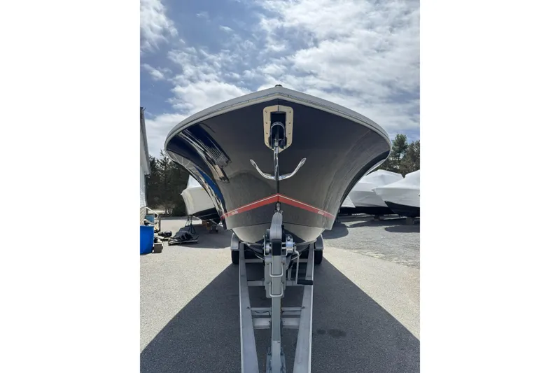 Slide: The Image of 2018 Regulator 34SS boat on trailer under cloudy sky. - 99