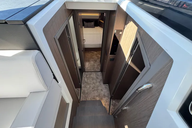 Slide: The Image of Interior view of 2026 Jeanneau NC 1295 Coupe, featuring modern cabin design. - 13