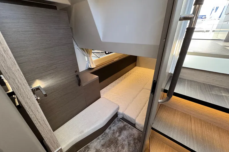 Slide: The Image of 2026 Jeanneau NC 1295 Coupe interior cabin with modern design and cozy seating. - 14