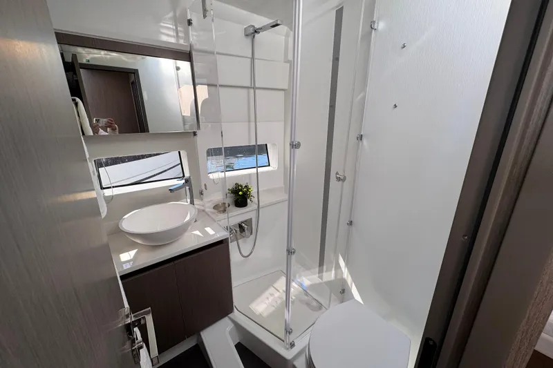 Slide: The Image of Modern bathroom in 2026 Jeanneau NC 1295 Coupe yacht with sleek fixtures and shower. - 16