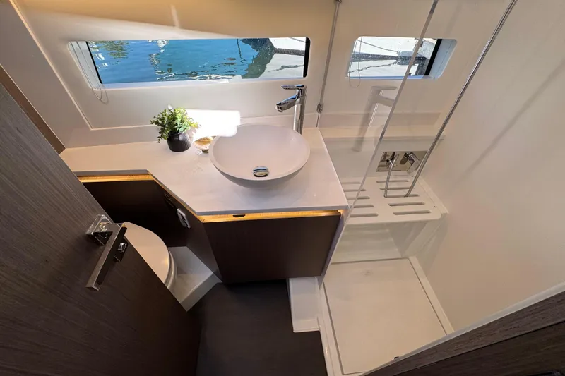 Slide: The Image of Modern bathroom interior of 2026 Jeanneau NC 1295 Coupe yacht, featuring sleek design and fixtures. - 17