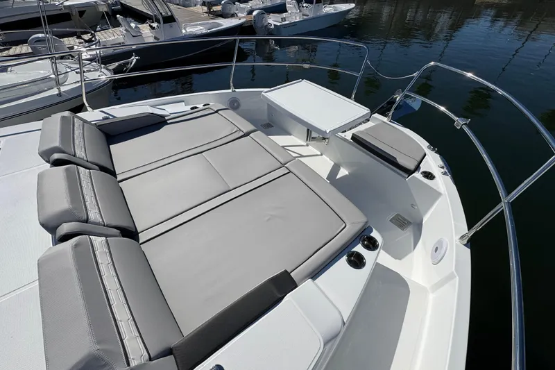 Slide: The Image of 2026 Jeanneau NC 1295 Coupe boat with spacious sunbathing area and sleek design. - 21