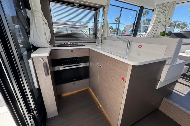 Slide: The Image of Modern kitchen interior of 2026 Jeanneau NC 1295 Coupe yacht with sleek design. - 8