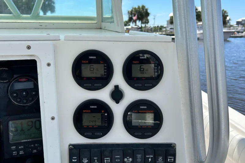 Slide: The Image of Dashboard of a 2005 Regulator 26 Forward Seating boat with Yamaha gauges. - 21