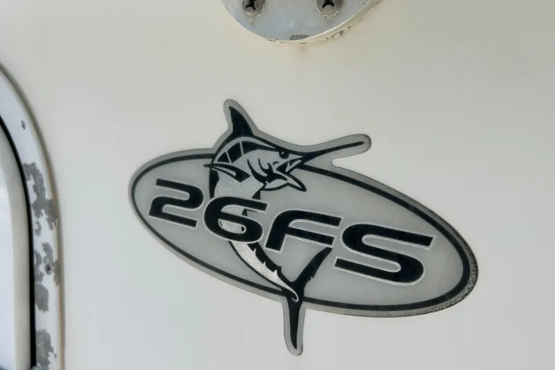 Slide: The Image of Regulator 26 Forward Seating 2005 logo with marlin design on boat exterior. - 25