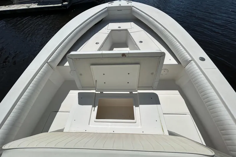 Slide: The Image of 2005 Regulator 26 Forward Seating boat with open storage compartment on deck. - 31