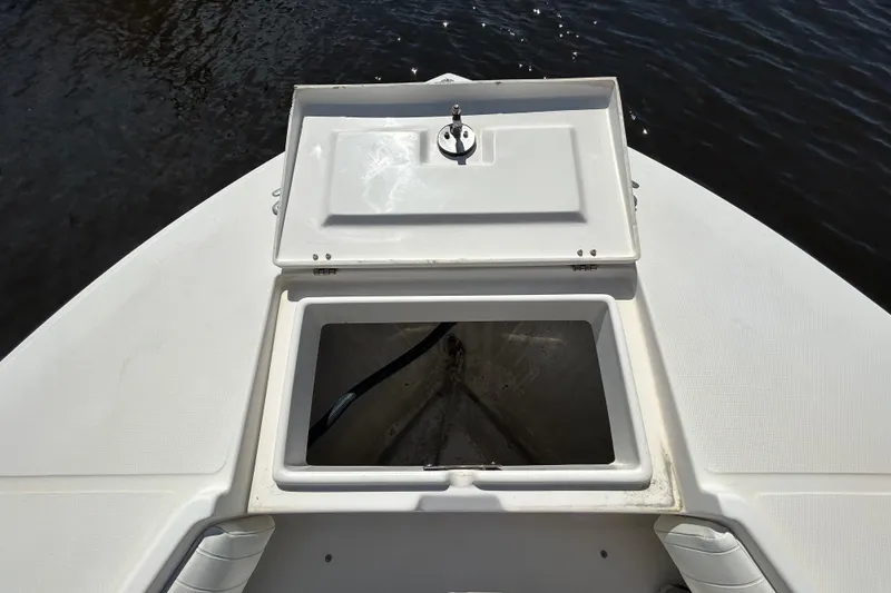 Slide: The Image of 2005 Regulator 26 Forward Seating boat with open storage compartment on deck. - 34