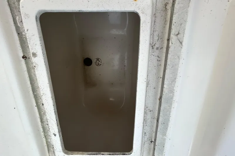 Slide: The Image of Storage compartment of a 2005 Regulator 26 Forward Seating boat. - 9