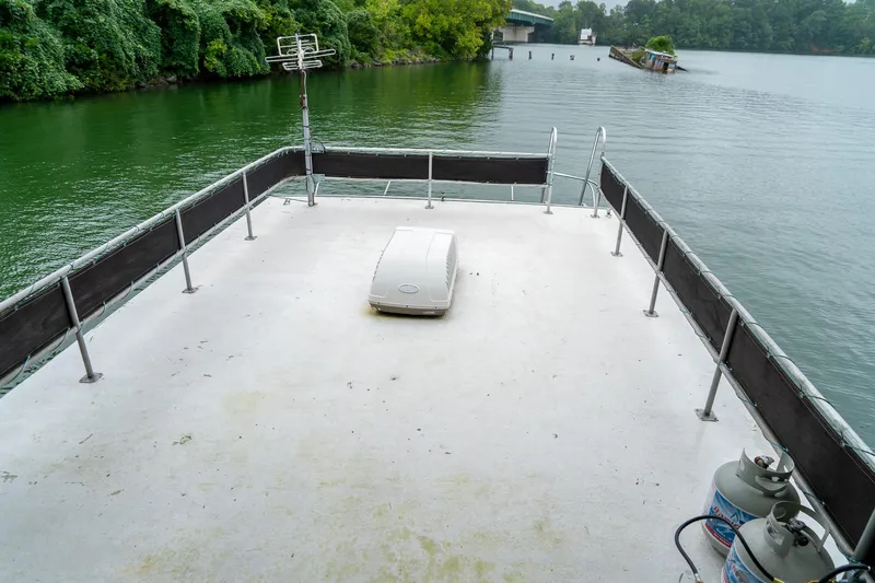 Slide: The Image of Rooftop deck of 1984 Sumerset 60 X 14 houseboat on a serene lake. - 44
