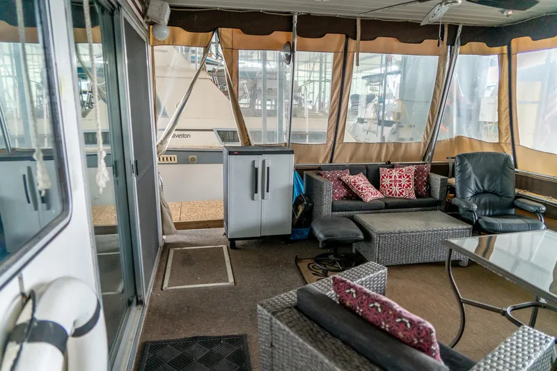 Slide: The Image of 1984 Sumerset 60 X 14 houseboat interior with cozy seating and modern decor. - 9
