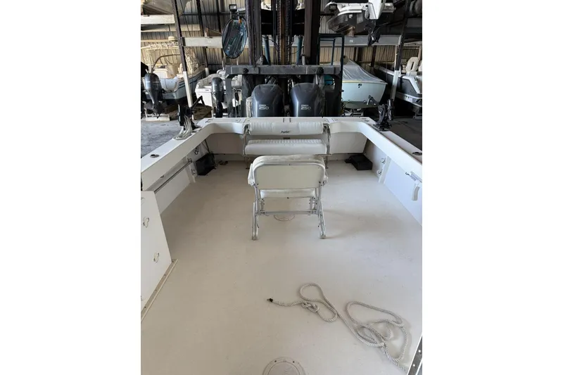 Slide: The Image of 2006 Parker 2820 XL Sport Cabin boat interior with seating and storage. - 10