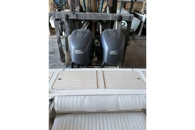 Slide: The Image of 2006 Parker 2820 XL Sport Cabin with twin Yamaha 250 engines in a garage. - 3