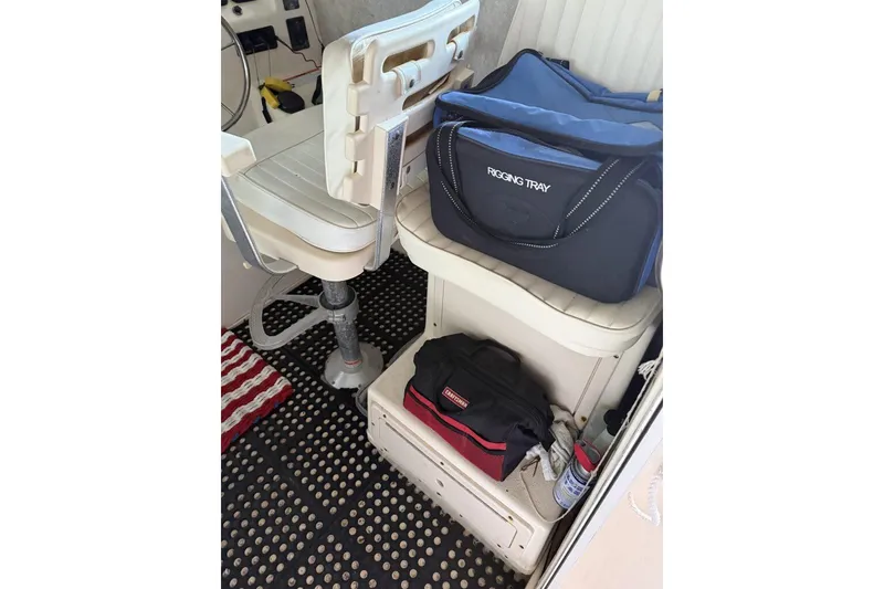 Slide: The Image of Interior of 2006 Parker 2820 XL Sport Cabin with rigging tray and storage bags. - 6